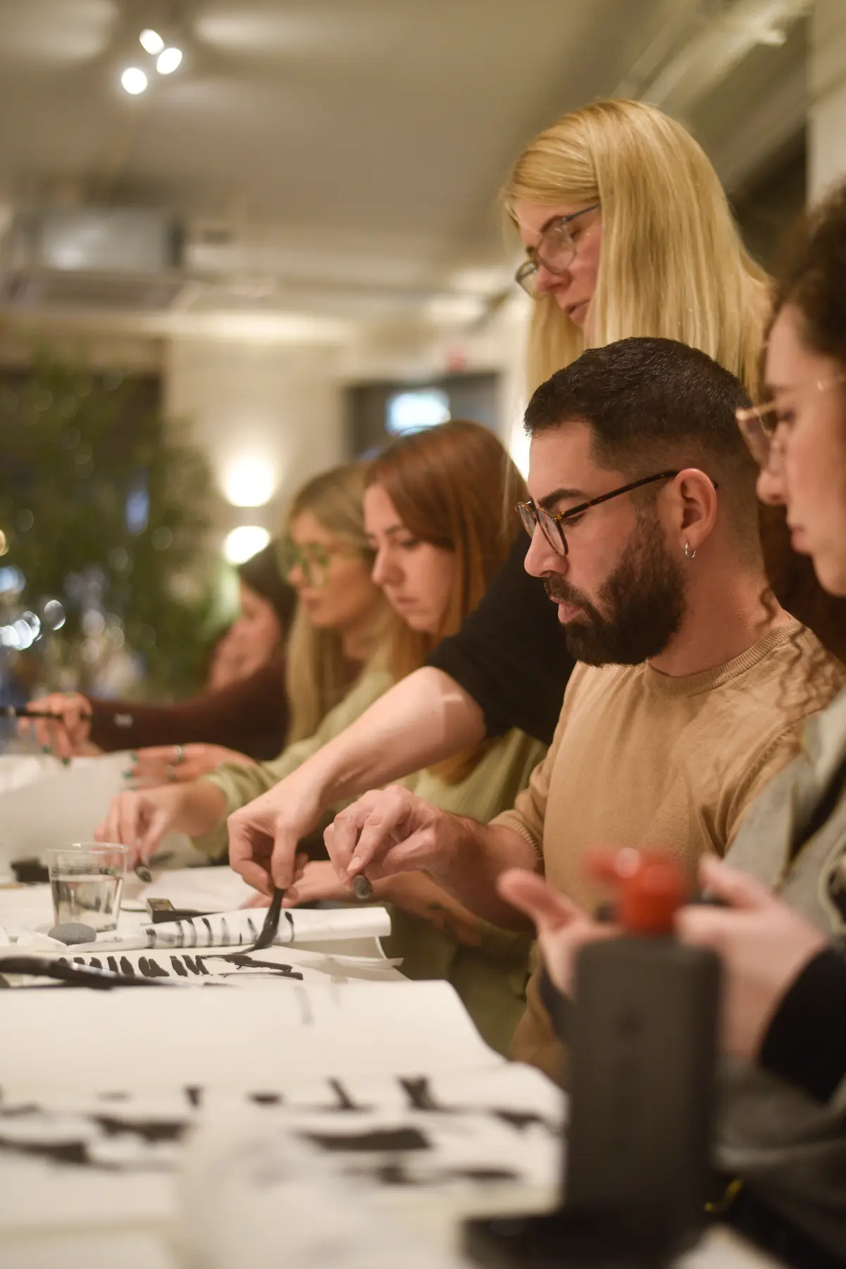 Jurga guiding participants during an intimate BonBon Sumi-e workshop