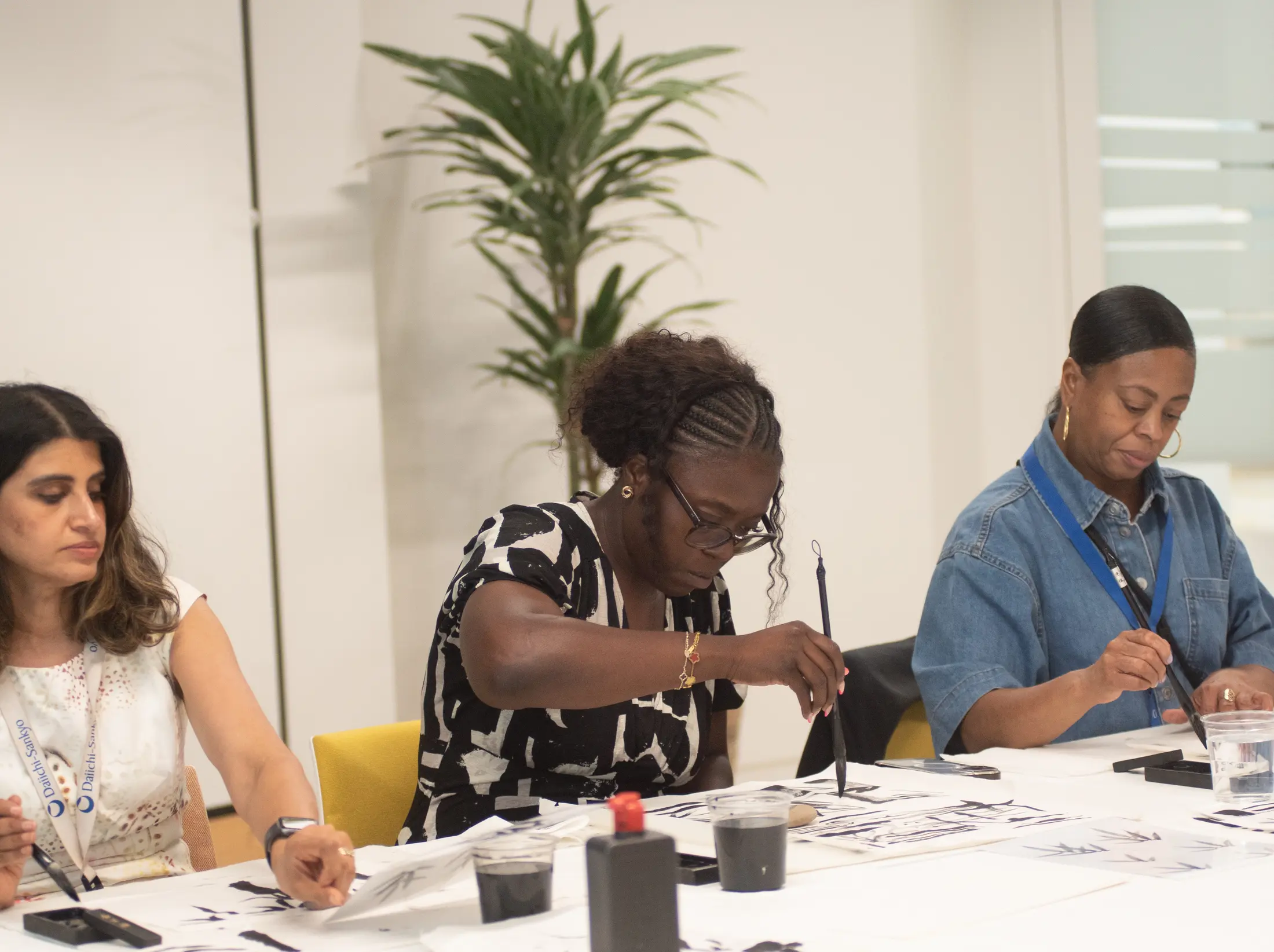 Colleagues painting together during a corporate Artivian workshop
