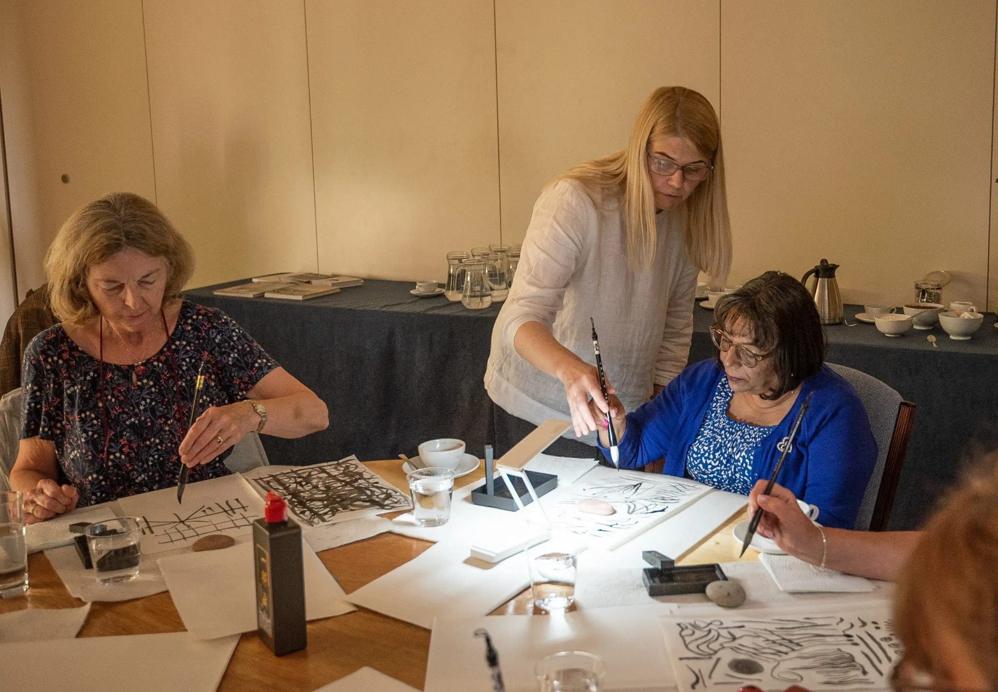 Jurga Vilimaite giving individual Sumi-e guidance during an Artivian workshop